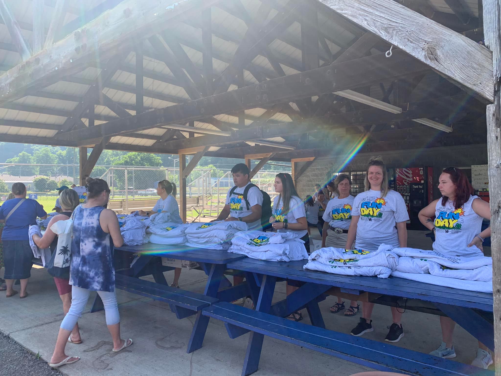 Volunteers at the shirt give a way table, handing out 1500 t shirts